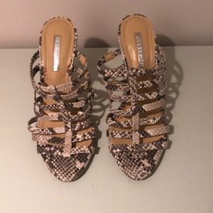 BCBG caged snakeskin heels